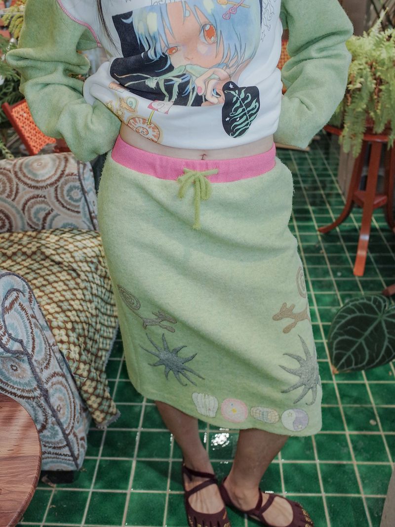 UnsocialNight(アンソーシャルナイト)の「UnsocialNight original design autumn and winter light green cute illustration printed half skirt female(Skirts)」