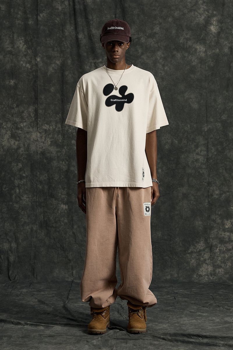 GRAFFITIONMIND（グラフィティオンマインド）の「Logo Pigment T-shirt (Cream)（Tops）」