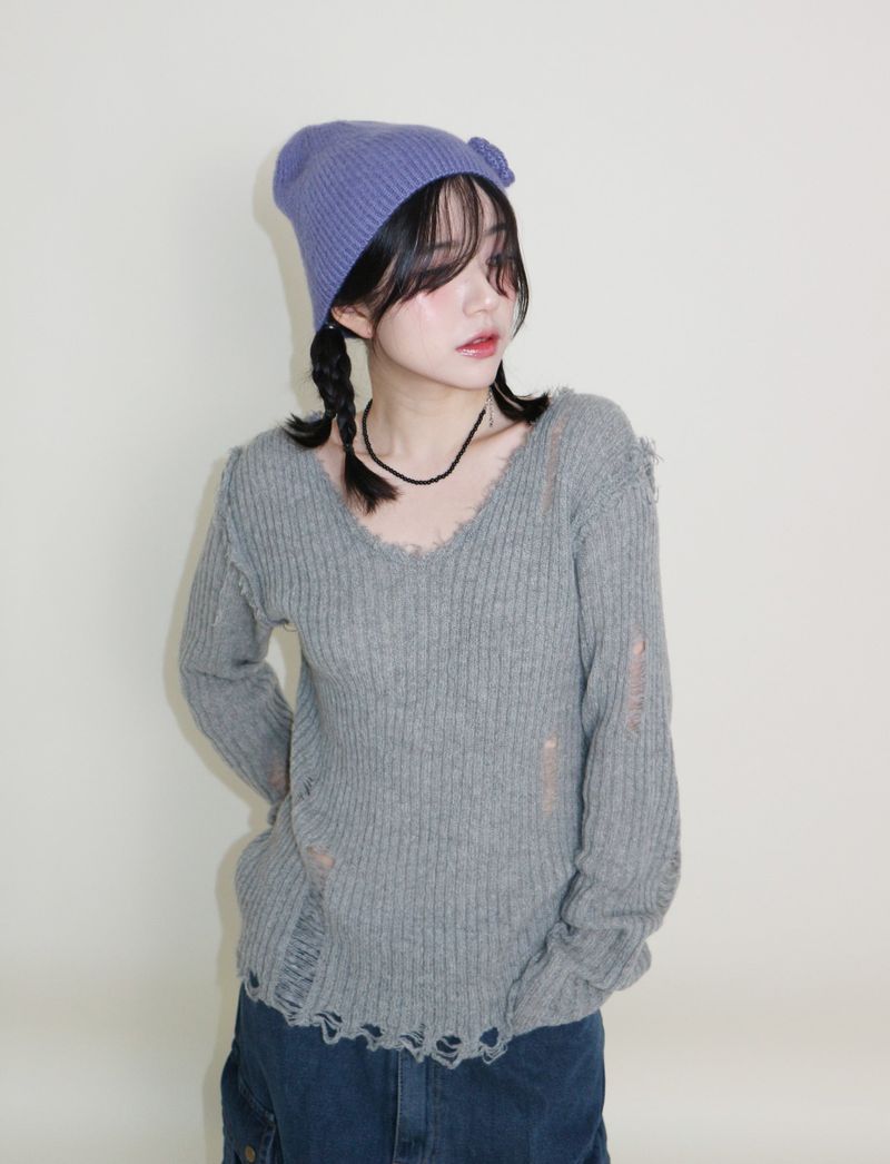 UZYOUNG（ユズヨン）の「ラバーVネックダメージカットポイント長袖ニット (wool material)（トップス）」
