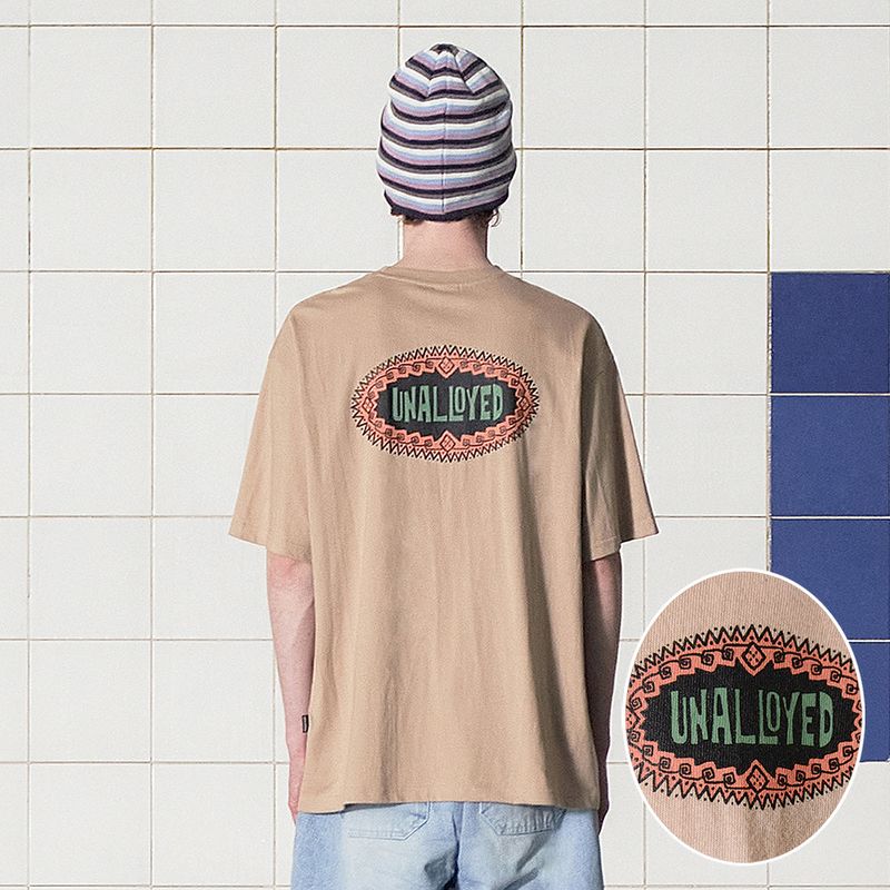 UNALLOYED（アナロイド）の「SYMBOL LOGO T SHIRT / BEIGE（Tops）」