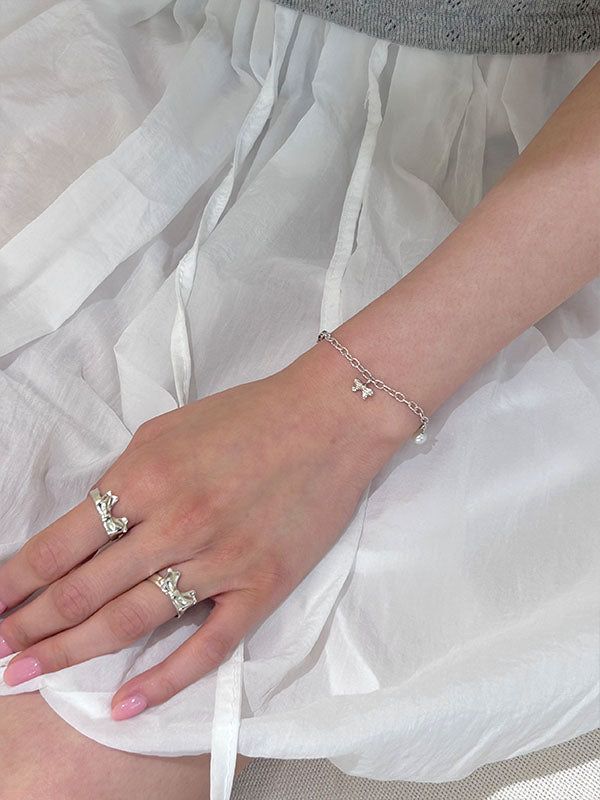 DANI（ダニ）の「Charm Bracelet (Wing&Star)（Accessories）」