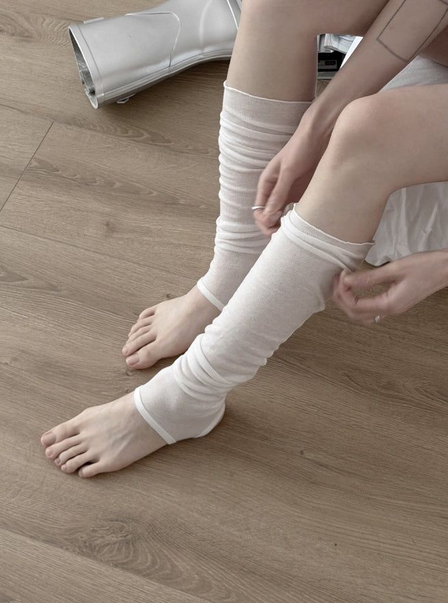 mnem（ムネム）の「Cier See-through Long Leg Warmers（Fashion Accessories）」