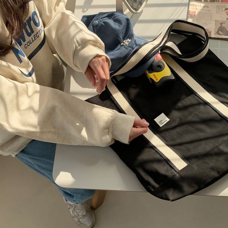 White on black tote bag