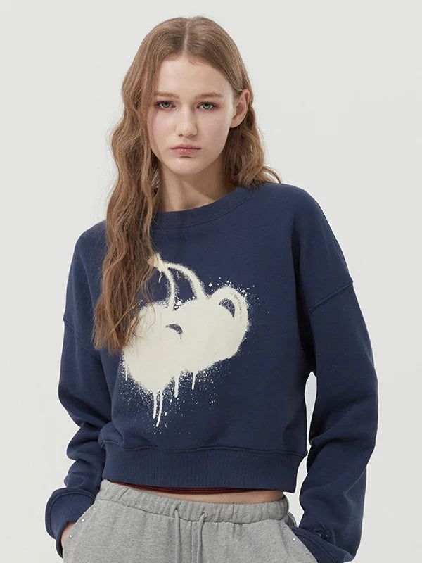 KIRSH（キルシー）の「MELTING CHERRY PRINTED CROP SWEATSHIRT - DARK NAVY （Tops）」