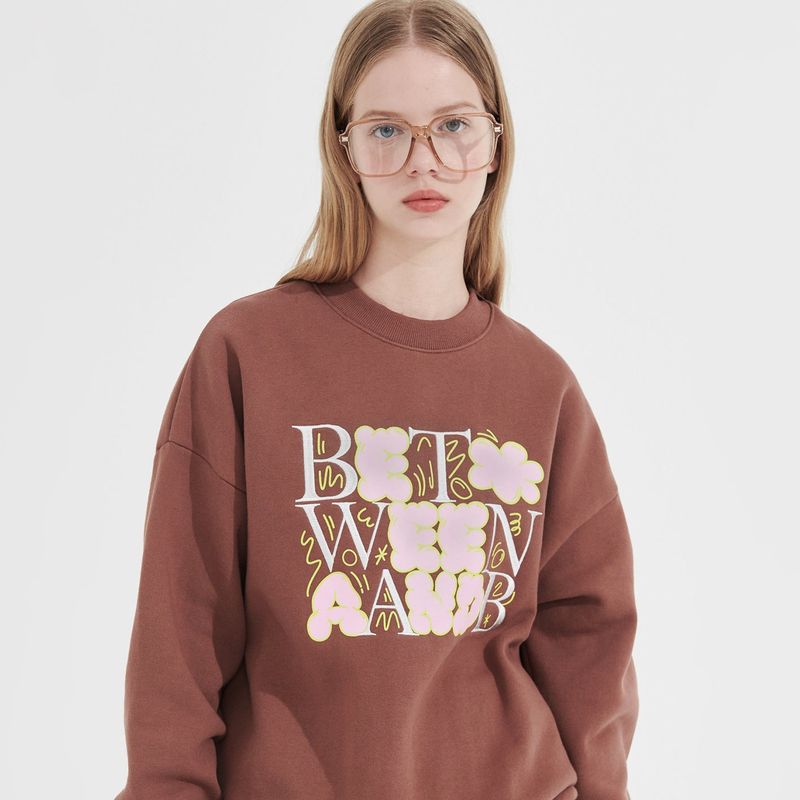 Between A and B(ビットウィーンエーアンドビー)の「Bubble Graphic Sweatshirt _ Brown(Tops)」