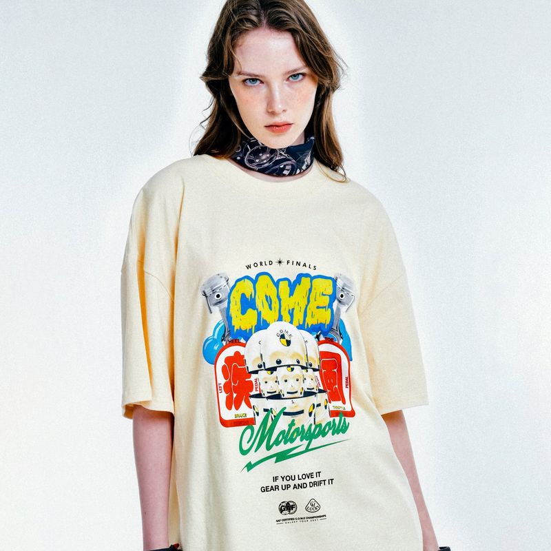 C.O.M.E（シーオーエムイー）の「[UNISEX] C.O.M.E Motorsports Oversized Printed Cotton-Jersey T-Shirt (Beige)（Tops）」