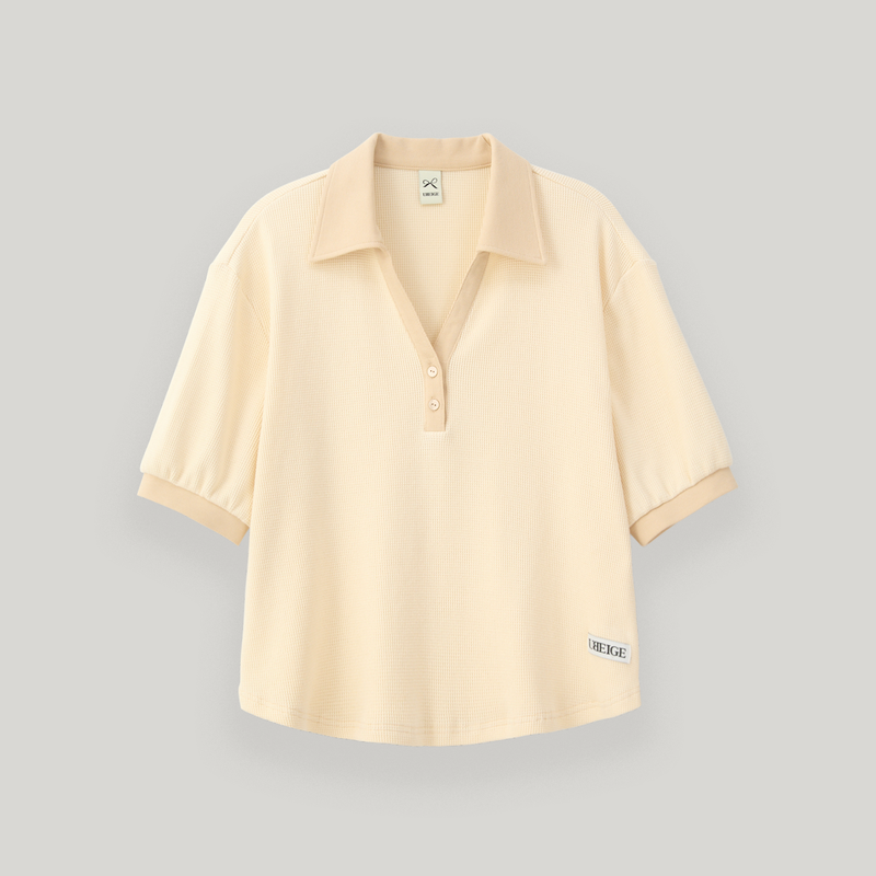 UBEIGE(ユーベイジ)の「Cream Half Open Collar Tee(Tops)」