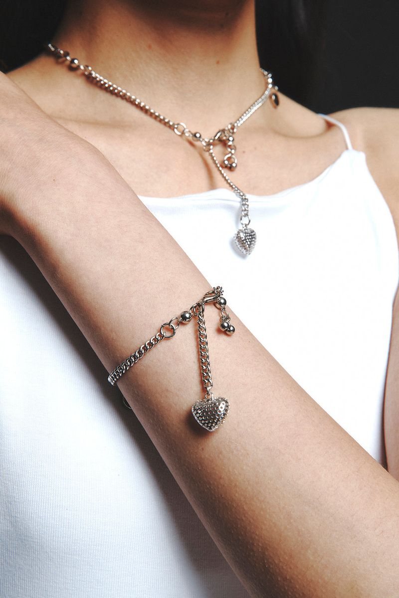 HEART PIERCING NECKLACE