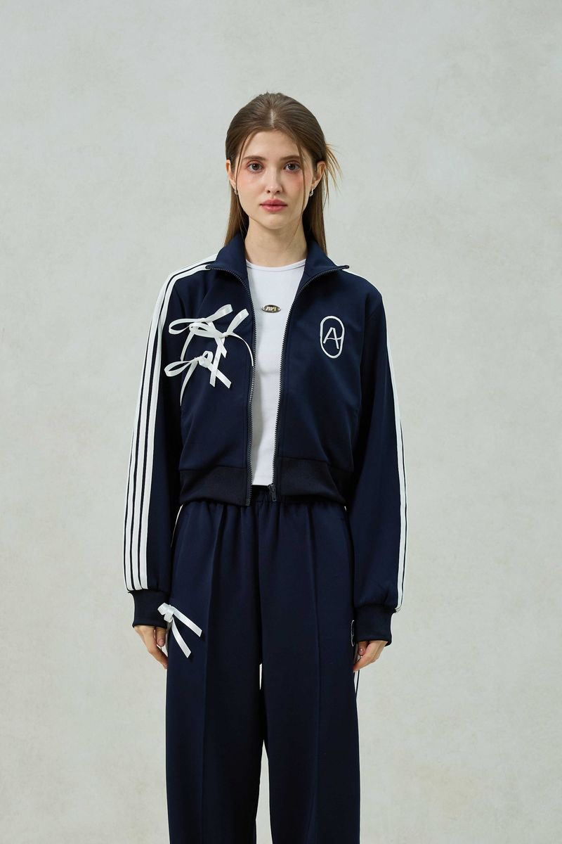 ARIKIM（アリキム）の「RIBBON JERSEY TRACK TOP / NAVY（Tops）」