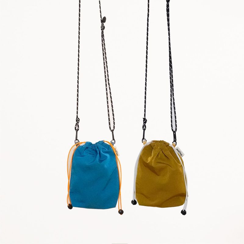 JACKOBAG（ジャックコバッグ）の「Nylon pouch bag - BLUE / MUSTARD（Bags）」