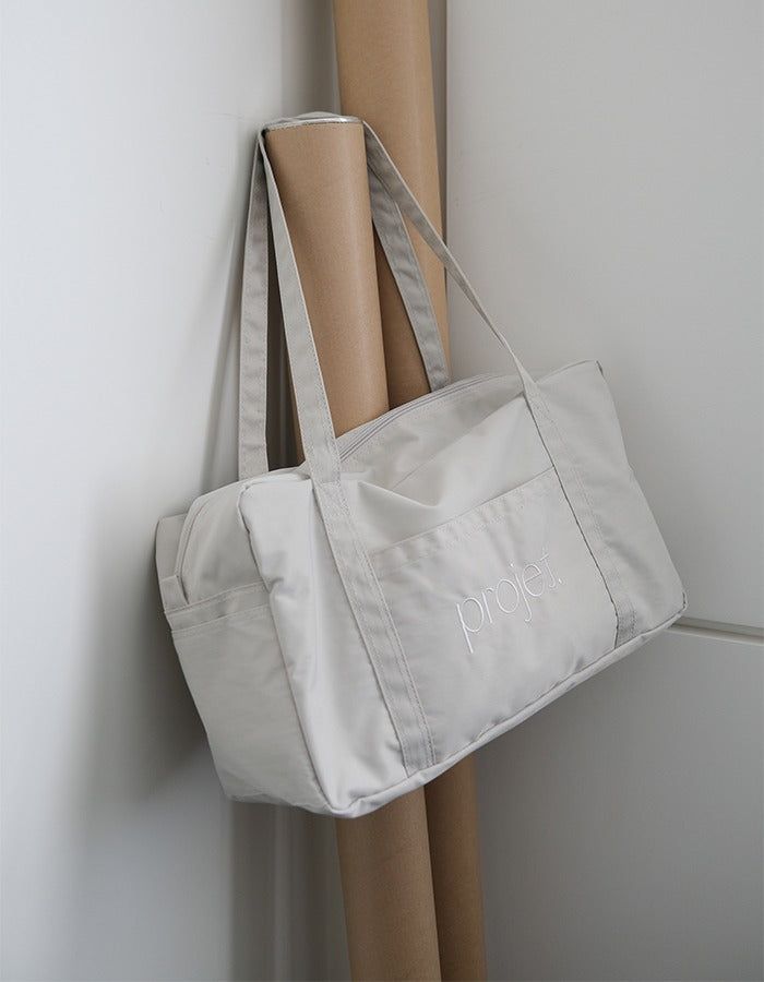 projet（プロジェ）の「standard duffle bag (light grey)（Bags）」