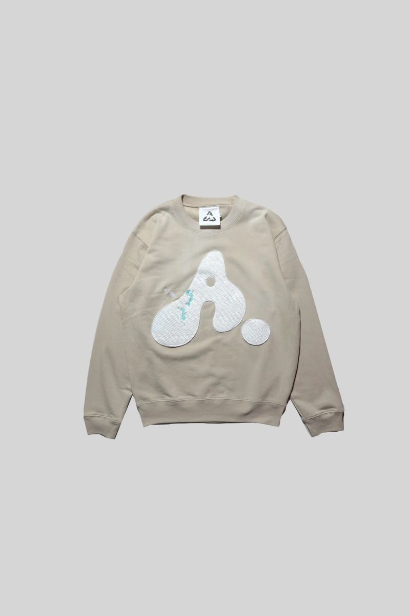 AWESOME BOY（オーサムボーイ）の「エンブロイダード ペイント"A"ロゴ ウォッシュド クルーネック スウェット(BEIGE)（トップス）」